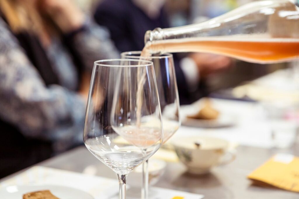 Rosé wine poured into glasses during the sensory tasting team-building event